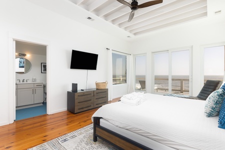 Tons of natural light filter in from the windows in your primary king bedroom