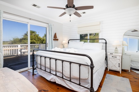 Your primary bedroom offers a king bed, en suite bathroom, and direct access to the back deck