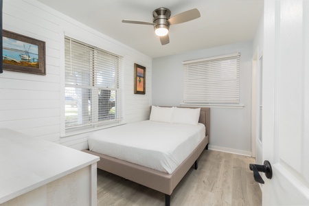 Your main floor queen bedroom sits just off the dining area