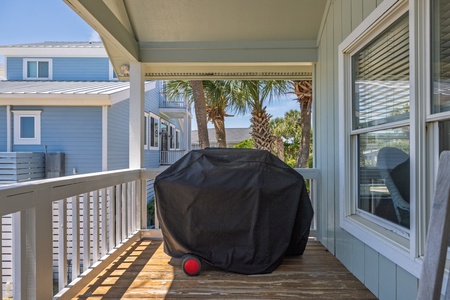Your covered back balcony features a grill for cooking out