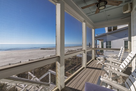 Relax in your private oceanfront retreat with sweeping beach views and gentle sea breezes flowing through this covered deck.