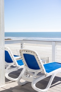 Unwind on your private balcony with ocean views, where comfortable loungers await your morning coffee or sunset cocktails.