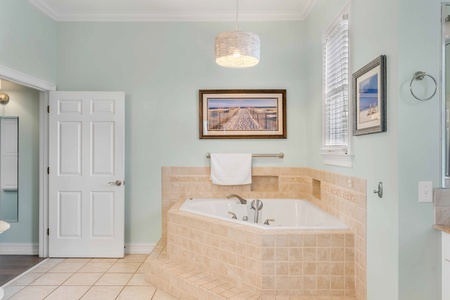 Indulge in the large jacuzzi tub in your upstairs primary bathroom