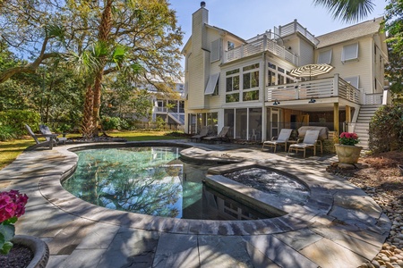 Your private oasis awaits with a sparkling pool and bubbling hot tub, perfectly positioned for sunny afternoons and starlit evening soaks.