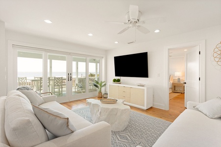 Settle into your cozy living room with views of the ocean beyond