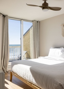 Wake up to stunning sea views from your comfortable bed. Cool ocean breezes flow through your private balcony doors.