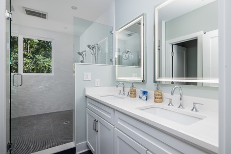 Dual vanities are ready for you in your primary bathroom