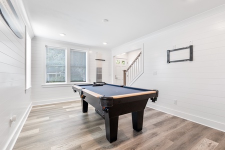 Challenge friends to a game in your private billiards room, featuring a professional pool table
