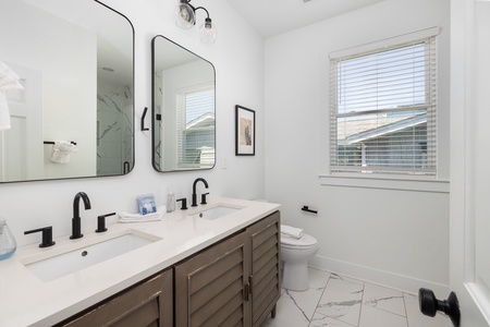 Your private bathroom features a walk-in shower and dual vanity