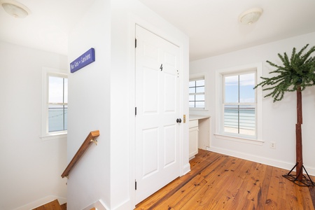 Take the wooden staircase to your rooftop deck and wet bar
