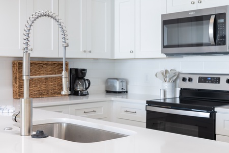 Your fully equipped kitchen features modern appliances and sleek countertops, perfect for preparing meals during your stay.