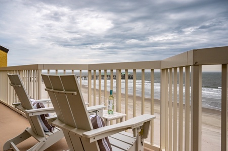 Unwind on your private balcony with ocean views. Sip your favorite drink while watching waves roll onto the sandy shore from comfortable seating.