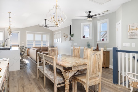Gather around this rustic dining table where your group can share memorable meals under elegant lighting with ocean breezes flowing through.