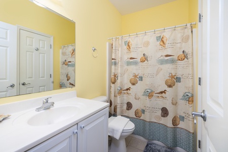Your bright and cheery bunk en suite bathroom is a great place for the kids to wash up after a day at the beach