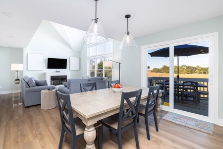 The dining table seats six and the adjacent French doors lead to your private deck.