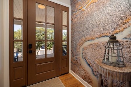 French doors lead you into your entryway