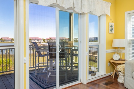 Step through the glass doors to your screened in porch
