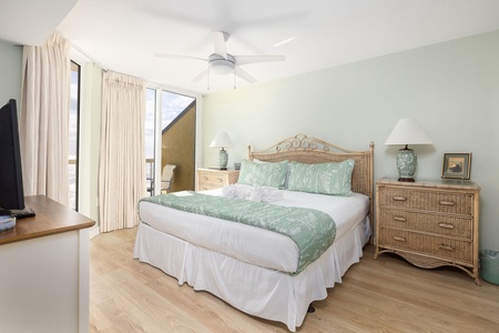 Unwind in your serene bedroom with coastal-inspired decor, plush bedding, and natural light streaming through expansive windows.