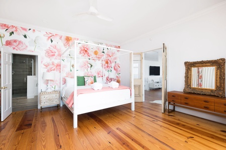 A king size four-poster bed awaits you in your primary bedroom