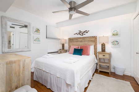 Our Folly Place features two queen bedrooms decorated with coastal furnishing