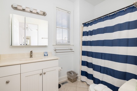 The first en suite bathroom offers a tub-shower combo