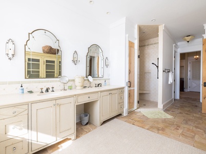 Your primary bathroom features a soaking tub, walk-in shower, and dual vanities