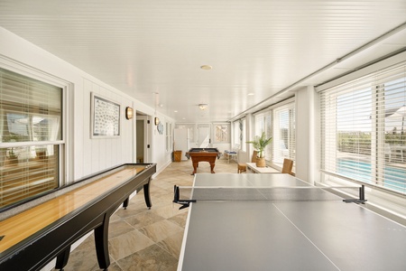 A ping pong table, billiards table, and shuffle board are all available in your ground level game room