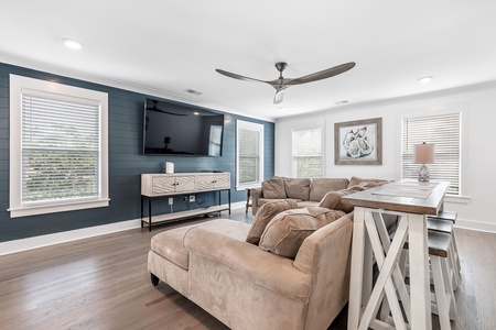 Your cozy living space features a smart TV and oversized sectional sofa