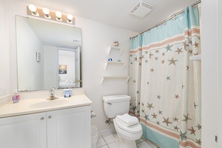 Freshen up in your private en suite bath with access from the queen bedroom