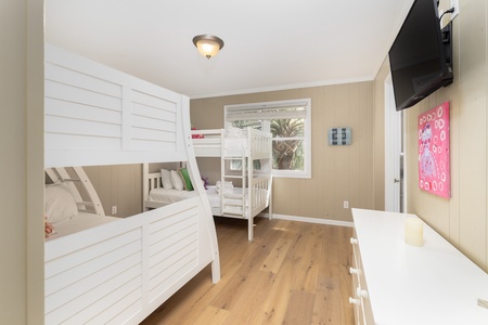 A twin-over-queen and twin-over-twin bunk room sleeps up to 4 people