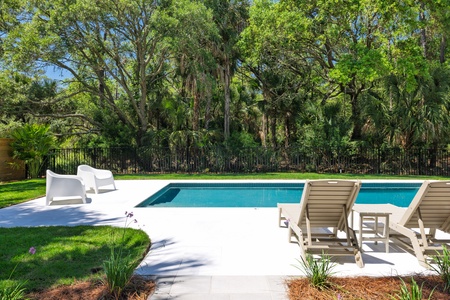 Step out back to your private pool oasis