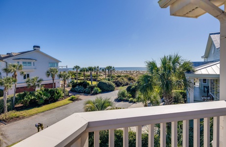 Wake up to stunning ocean glimpses from your upstairs balcony