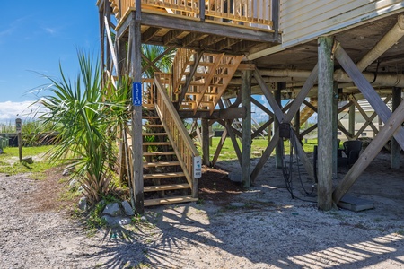 The property features convenient beach access with parking directly beneath the home, making it easy to unload your gear and start your vacation.
