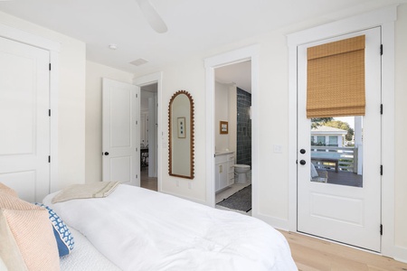 Drift off in your serene bedroom with crisp linens and natural light filtering through bamboo shades.