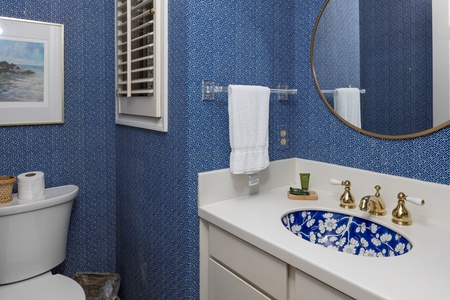 Freshen up in this ornate hall bathroom