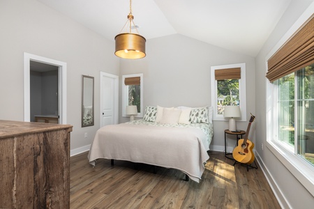 The charming primary bedroom features an en suite bathroom and plenty of natural light