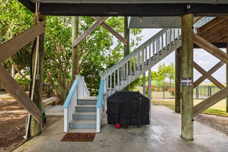 Take the stairs from the covered carport to your back entrances