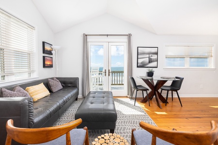 Step into your bright coastal retreat where natural light pours through every window and the ocean awaits just beyond your private balcony. Sink into the plush leather sofa and let the sea breeze carry away your worries.