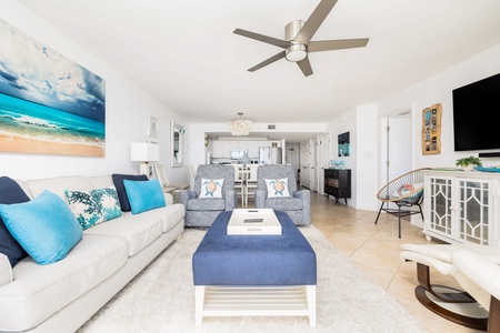 The living room features a queen sized pullout sofa