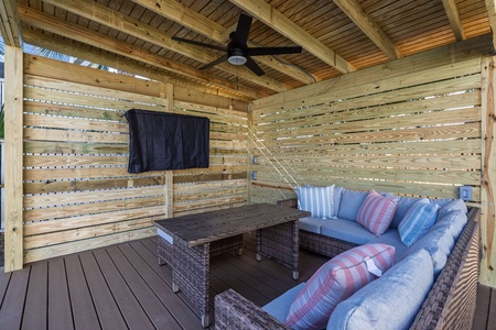 Unwind in your private covered patio with plush seating and ceiling fan, perfect for morning coffee or evening conversations under the stars.