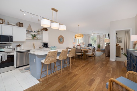 Step into your beautifully designed open-concept space where modern coastal style meets comfort, perfect for cooking and gathering