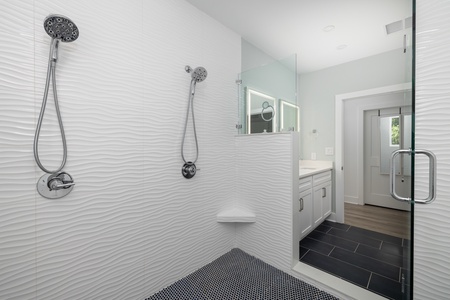 Enjoy this oversized tiled shower with soaking tub