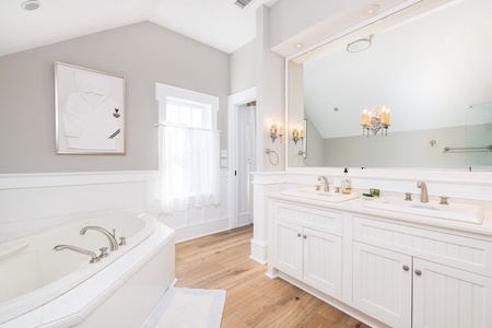 Your upstairs king room has a large en suite bathroom with jacuzzi tub and walk-in shower