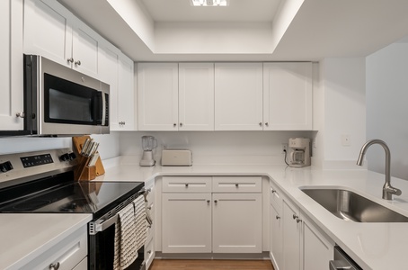 Your bright, fully-equipped kitchen features modern appliances and ample counter space for preparing memorable meals during your stay.