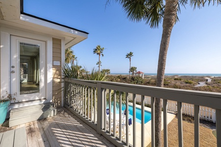 Your upstairs balcony overlook the pool and putting green