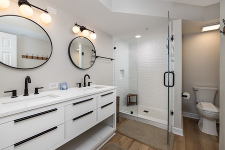 Your primary en suite features dual vanities and a walk-in shower