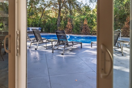 The doors from your living room take you straight out to your pool