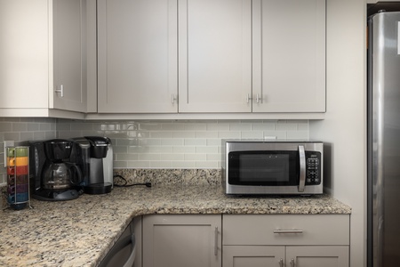 Your modern kitchen awaits with granite counters, stainless appliances, and everything needed for convenient meal prep during your stay.
