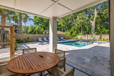 Watch the kids play in the pool from the comfort of your shaded patio
