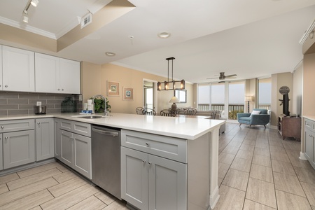 Your open concept kitchen provides views of the living room and Folly Beach beyond